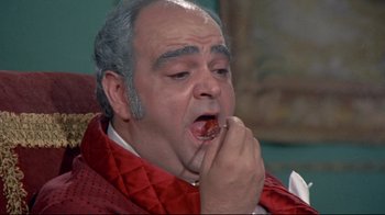 Movie still from “A New Leaf” (1971), directed by Elaine May – An older man is eating a piece of food; Close Up shot, High angle