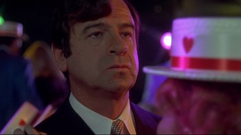 Movie still from “A New Leaf” (1971), directed by Elaine May – A person wearing a suit and tie; Close Up shot, Low angle