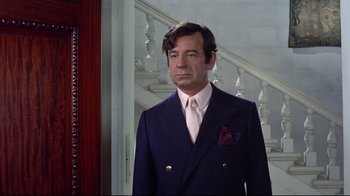 Movie still from “A New Leaf” (1971), directed by Elaine May – A person wearing a suit and tie; Medium shot, Over the shoulder angle