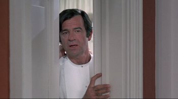 Movie still from “A New Leaf” (1971), directed by Elaine May – A person standing in a room; Medium shot, Low angle