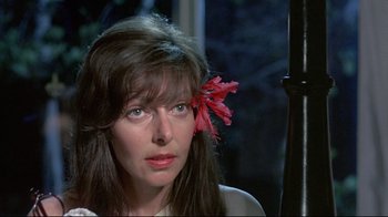 Movie still from “A New Leaf” (1971), directed by Elaine May – A person with a flower in her hair; Close Up shot, Over the shoulder angle