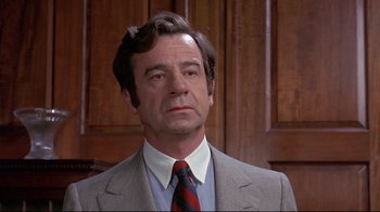 Movie still from “A New Leaf” (1971), directed by Elaine May – A person wearing a suit and tie; Close Up shot, Low angle