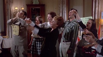 Movie still from “A New Leaf” (1971), directed by Elaine May – A group of people standing in a living room; Medium shot, Low angle