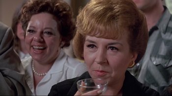 Movie still from “A New Leaf” (1971), directed by Elaine May – Two women sitting at a table drinking wine; Close Up shot, Over the shoulder angle