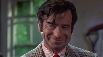 Movie still from “A New Leaf” (1971), directed by Elaine May – A person wearing a suit and tie; Close Up shot, Low angle