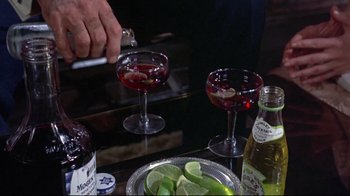 Movie still from “A New Leaf” (1971), directed by Elaine May – A person is preparing a cocktail at a party; Extreme Close Up shot, High angle