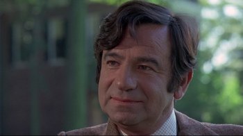 Movie still from “A New Leaf” (1971), directed by Elaine May – A person wearing a suit and tie; Close Up shot, Over the shoulder angle