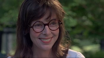Movie still from “A New Leaf” (1971), directed by Elaine May – A person wearing glasses; Close Up shot, Over the shoulder angle