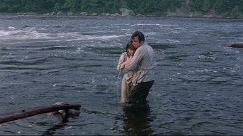 Movie still from “A New Leaf” (1971), directed by Elaine May – A man and a woman in a body of water; Wide shot, High angle