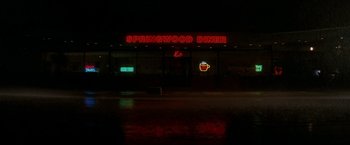 Movie still from “A Nightmare on Elm Street” (2010), directed by Samuel Bayer – A neon sign that reads " springwood diner "; Extreme Wide shot, High angle