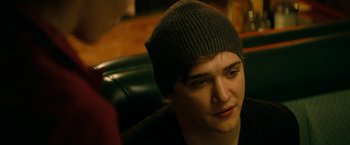 Movie still from “A Nightmare on Elm Street” (2010), directed by Samuel Bayer – A man wearing a hat sitting in front of a woman; Close Up shot, Over the shoulder angle