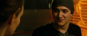 Movie still from “A Nightmare on Elm Street” (2010), directed by Samuel Bayer – A young man wearing a hat and smiling for the camera; Close Up shot, Over the shoulder angle