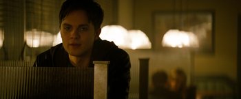 Movie still from “A Nightmare on Elm Street” (2010), directed by Samuel Bayer – A man sitting at a table in front of a lamp; Close Up shot, Over the shoulder angle