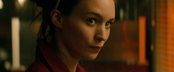 Movie still from “A Nightmare on Elm Street” (2010), directed by Samuel Bayer – A woman's face in a red shirt; Close Up shot, Over the shoulder angle