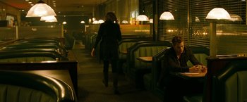 Movie still from “A Nightmare on Elm Street” (2010), directed by Samuel Bayer – A woman walking down the aisle of a restaurant; Wide shot, Over the shoulder angle