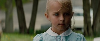 Movie still from “A Nightmare on Elm Street” (2010), directed by Samuel Bayer – A little girl with blonde hair wearing a blue dress; Close Up shot, Over the shoulder angle