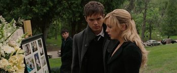 Movie still from “A Nightmare on Elm Street” (2010), directed by Samuel Bayer – A man and a woman standing next to each other in a park; Medium shot, Over the shoulder angle