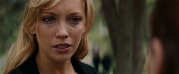 Movie still from “A Nightmare on Elm Street” (2010), directed by Samuel Bayer – A woman's face in a park setting; Close Up shot, Over the shoulder angle