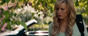 Movie still from “A Nightmare on Elm Street” (2010), directed by Samuel Bayer – A woman with long blonde hair standing in a park; Close Up shot, Over the shoulder angle