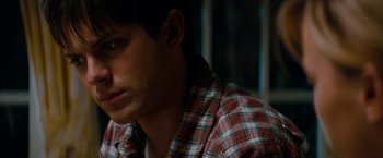Movie still from “A Nightmare on Elm Street” (2010), directed by Samuel Bayer – A man in a plaid shirt is looking down; Close Up shot, Over the shoulder angle