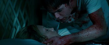 Movie still from “A Nightmare on Elm Street” (2010), directed by Samuel Bayer – A man and a woman laying in a bed with blood all over them; Close Up shot, Overhead angle