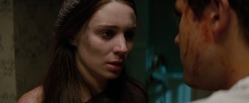 Movie still from “A Nightmare on Elm Street” (2010), directed by Samuel Bayer – A person looking at the camera; Close Up shot, Over the shoulder angle