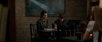 Movie still from “A Nightmare on Elm Street” (2010), directed by Samuel Bayer – A woman and a man sitting at a table with a laptop; Medium shot, Over the shoulder angle
