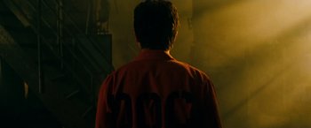 Movie still from “A Nightmare on Elm Street” (2010), directed by Samuel Bayer – A man in a red jacket standing in front of a wall; Close Up shot, Over the shoulder angle
