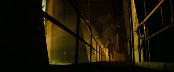 Movie still from “A Nightmare on Elm Street” (2010), directed by Samuel Bayer – A man walking down a hallway in a dark room; Wide shot, Low angle