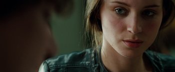 Movie still from “A Nightmare on Elm Street” (2010), directed by Samuel Bayer – A woman's face in a leather jacket; Close Up shot, Over the shoulder angle