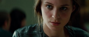 Movie still from “A Nightmare on Elm Street” (2010), directed by Samuel Bayer – A woman's face with a leather jacket on; Close Up shot, Over the shoulder angle