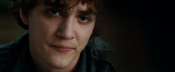 Movie still from “A Nightmare on Elm Street” (2010), directed by Samuel Bayer – A young man's face with green eyes; Close Up shot, Over the shoulder angle