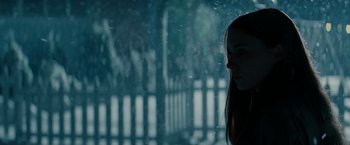 Movie still from “A Nightmare on Elm Street” (2010), directed by Samuel Bayer – A woman standing in the rain with a fence in the background; Close Up shot, Low angle