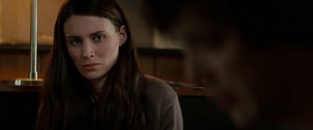 Movie still from “A Nightmare on Elm Street” (2010), directed by Samuel Bayer – A person sitting in a room; Close Up shot, Over the shoulder angle