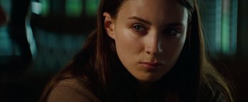 Movie still from “A Nightmare on Elm Street” (2010), directed by Samuel Bayer – A woman's face in a dark room; Close Up shot, Over the shoulder angle