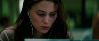 Movie still from “A Nightmare on Elm Street” (2010), directed by Samuel Bayer – A woman is listening to music on a laptop; Close Up shot, Over the shoulder angle
