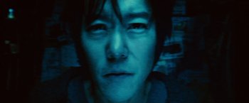 Movie still from “A Nightmare on Elm Street” (2010), directed by Samuel Bayer – A person's face in a dark room; Close Up shot, Overhead angle