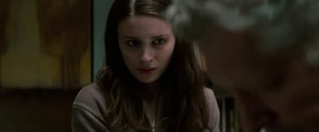 Movie still from “A Nightmare on Elm Street” (2010), directed by Samuel Bayer – A young woman stares into the camera; Close Up shot, Over the shoulder angle
