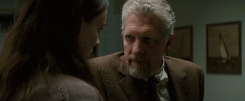 Movie still from “A Nightmare on Elm Street” (2010), directed by Samuel Bayer – An older man and a young woman are talking to each other; Close Up shot, Over the shoulder angle