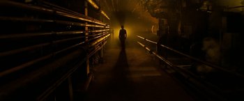 Movie still from “A Nightmare on Elm Street” (2010), directed by Samuel Bayer – A man is standing in a dark room; Extreme Wide shot, Low angle