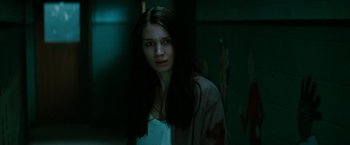 Movie still from “A Nightmare on Elm Street” (2010), directed by Samuel Bayer – A young woman with long dark brown hair; Close Up shot, Low angle