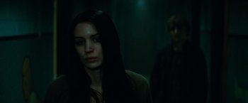 Movie still from “A Nightmare on Elm Street” (2010), directed by Samuel Bayer – A woman with long black hair standing next to a man; Close Up shot, Low angle