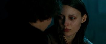 Movie still from “A Nightmare on Elm Street” (2010), directed by Samuel Bayer – A young woman looking at a young man in a dark room; Close Up shot, Over the shoulder angle