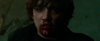 Movie still from “A Nightmare on Elm Street” (2010), directed by Samuel Bayer – A young man with blood all over his face; Close Up shot, Low angle