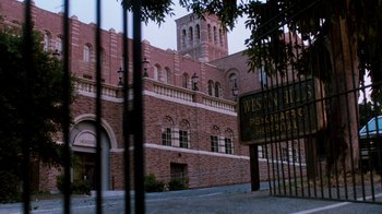 Movie still from “A Nightmare on Elm Street 3: Dream Warriors” (1987), directed by Chuck Russell – A large brick building with a sign in front of it; Extreme Wide shot, Low angle
