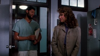 Movie still from “A Nightmare on Elm Street 3: Dream Warriors” (1987), directed by Chuck Russell – A man and a woman standing next to each other in a room; Medium shot, Over the shoulder angle