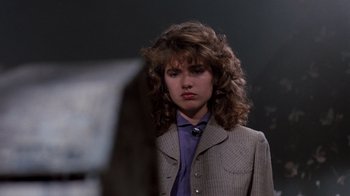 Movie still from “A Nightmare on Elm Street 3: Dream Warriors” (1987), directed by Chuck Russell – A young woman in a jacket and tie; Close Up shot, Over the shoulder angle