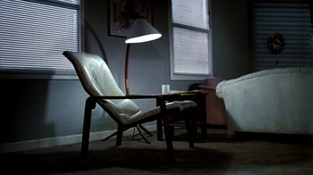 Movie still from “A Nightmare on Elm Street 3: Dream Warriors” (1987), directed by Chuck Russell – A chair and a table in a room; Wide shot, High angle
