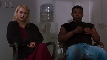Movie still from “A Nightmare on Elm Street 3: Dream Warriors” (1987), directed by Chuck Russell – A man and a woman sitting next to each other; Medium shot, High angle