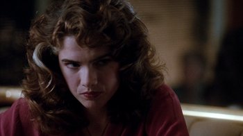 Movie still from “A Nightmare on Elm Street 3: Dream Warriors” (1987), directed by Chuck Russell – A person with curly hair; Close Up shot, Over the shoulder angle